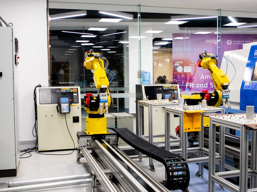 Robotic arms in action within a modern industrial control room setting, showcasing technology and production. Robotic arms in action within a modern industrial control room setting, showcasing technology and production.