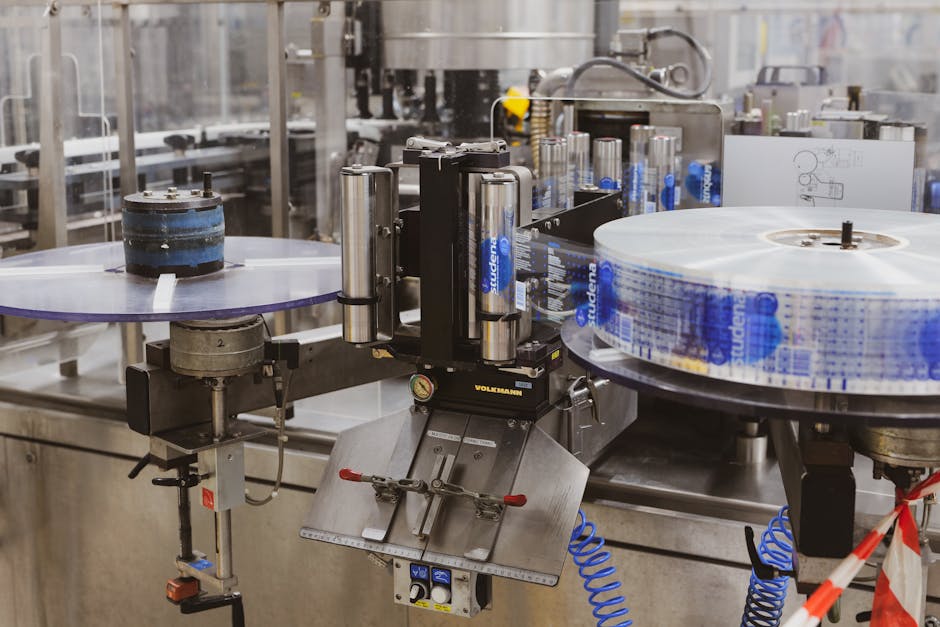 Close-up of automated machinery in a Lipik factory's production line. Close-up of automated machinery in a Lipik factory's production line.