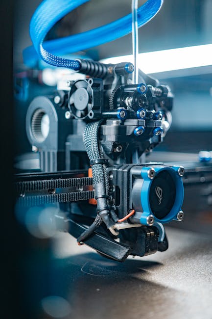 Close-up view of a high-tech 3D printer in operation, capturing detailed mechanics.