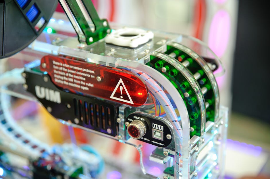 Detailed view of industrial technology showing connectors and warning label.