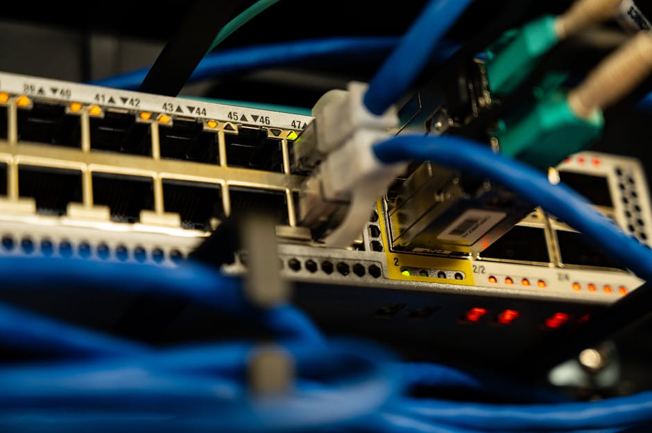 Close-up image of ethernet cables plugged into a network switch, showcasing IT infrastructure. Close-up image of ethernet cables plugged into a network switch, showcasing IT infrastructure.