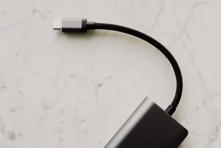 High-quality USB-C cable with connector displayed on elegant marble background for tech enthusiasts.