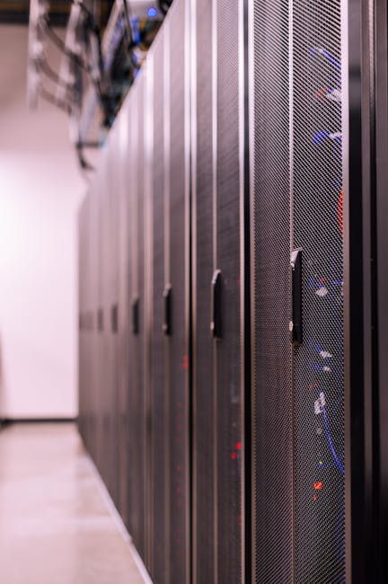 Detailed view of network server racks in a modern data center, highlighting technology infrastructure. Detailed view of network server racks in a modern data center, highlighting technology infrastructure.