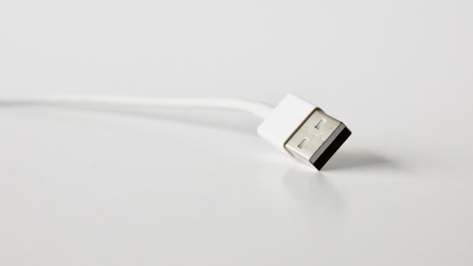 A detailed close-up image of a USB cable, perfect for technology-related projects. A detailed close-up image of a USB cable, perfect for technology-related projects.