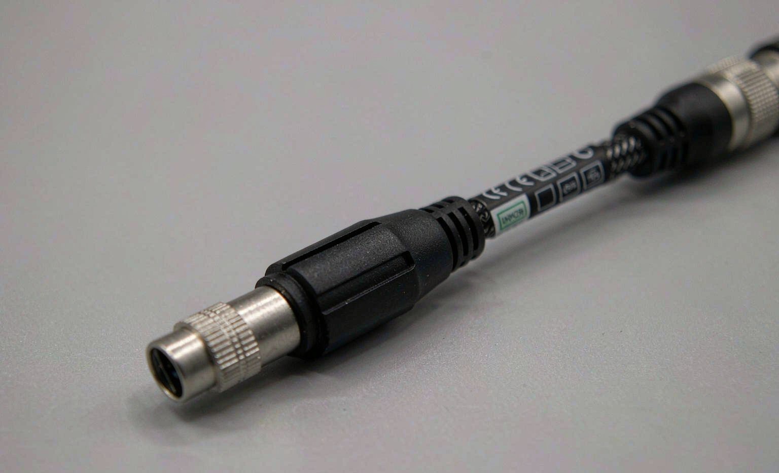 Compliance marks CE RoHS and USB-IF on a cable label