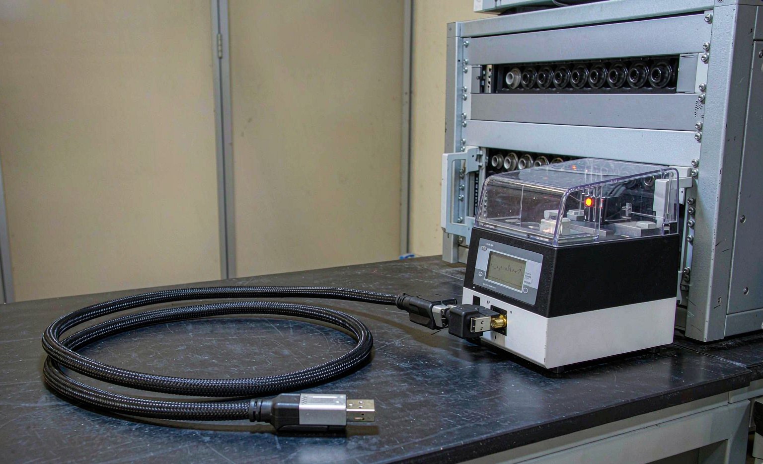 Finished USB cable under electrical test on an automated tester
